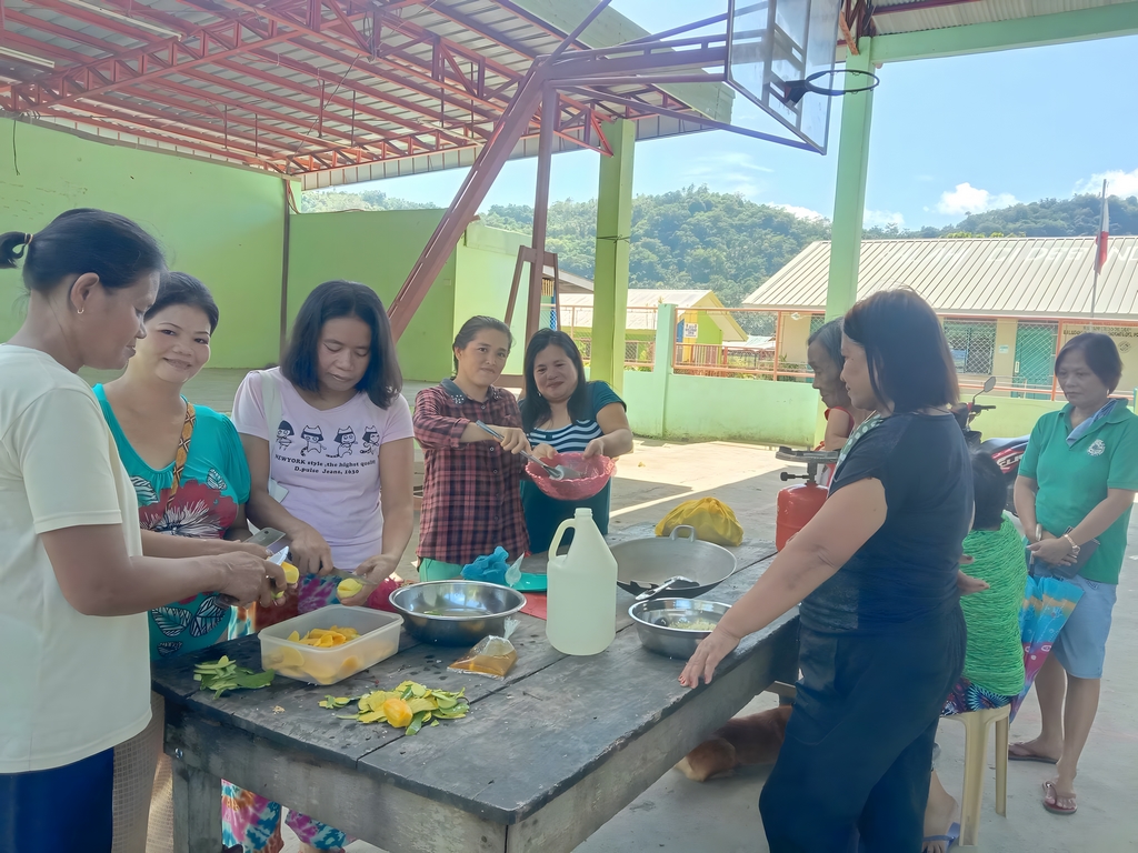 A group of marginalized women working together and smiling