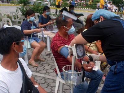 A group of medical volunteers from VMCLF providing free medical check-ups to residents of a community in Davao City, Philippines.